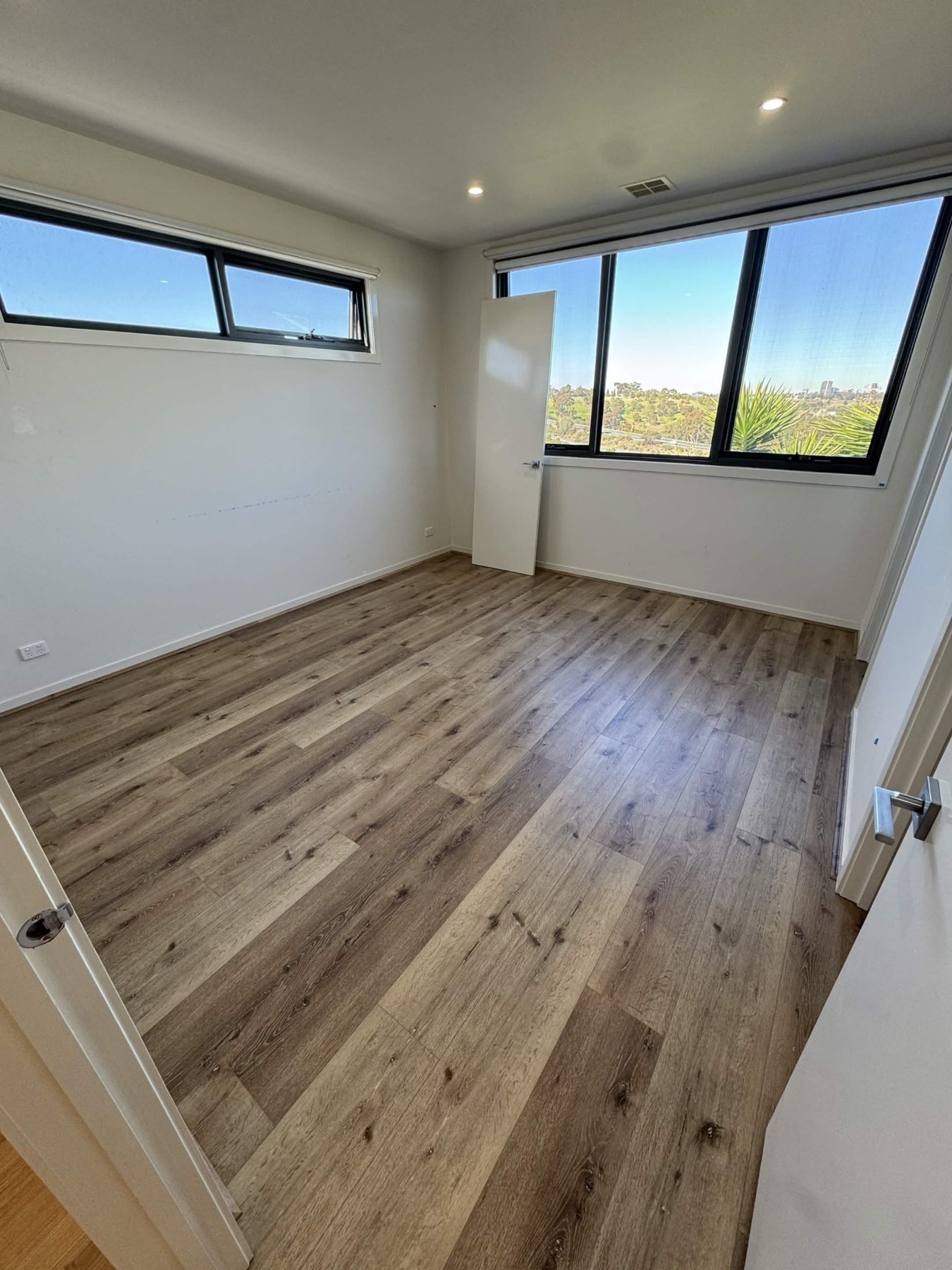 Brown toned flooring in a bedroom