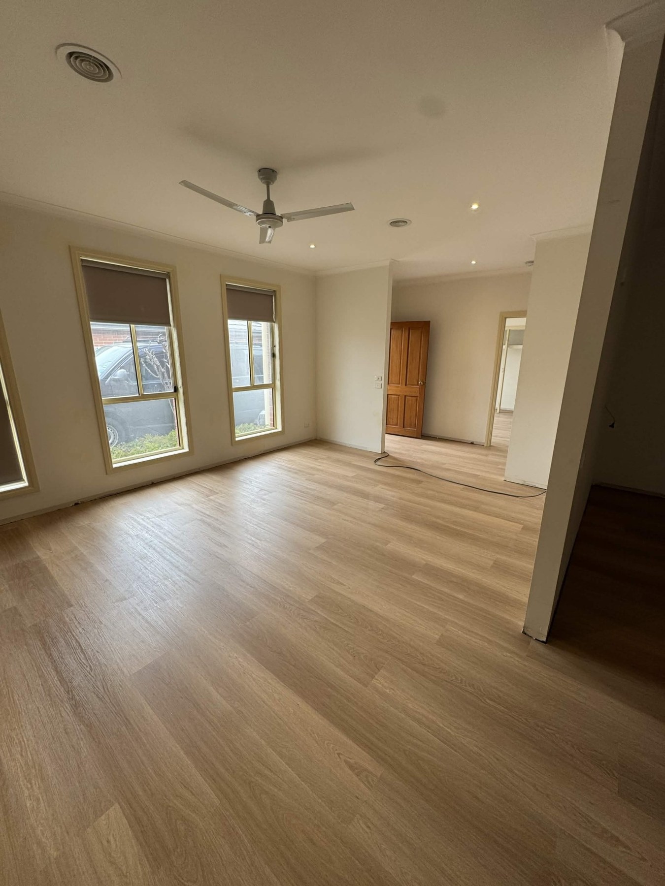 Light hybrid flooring installed in a bright room