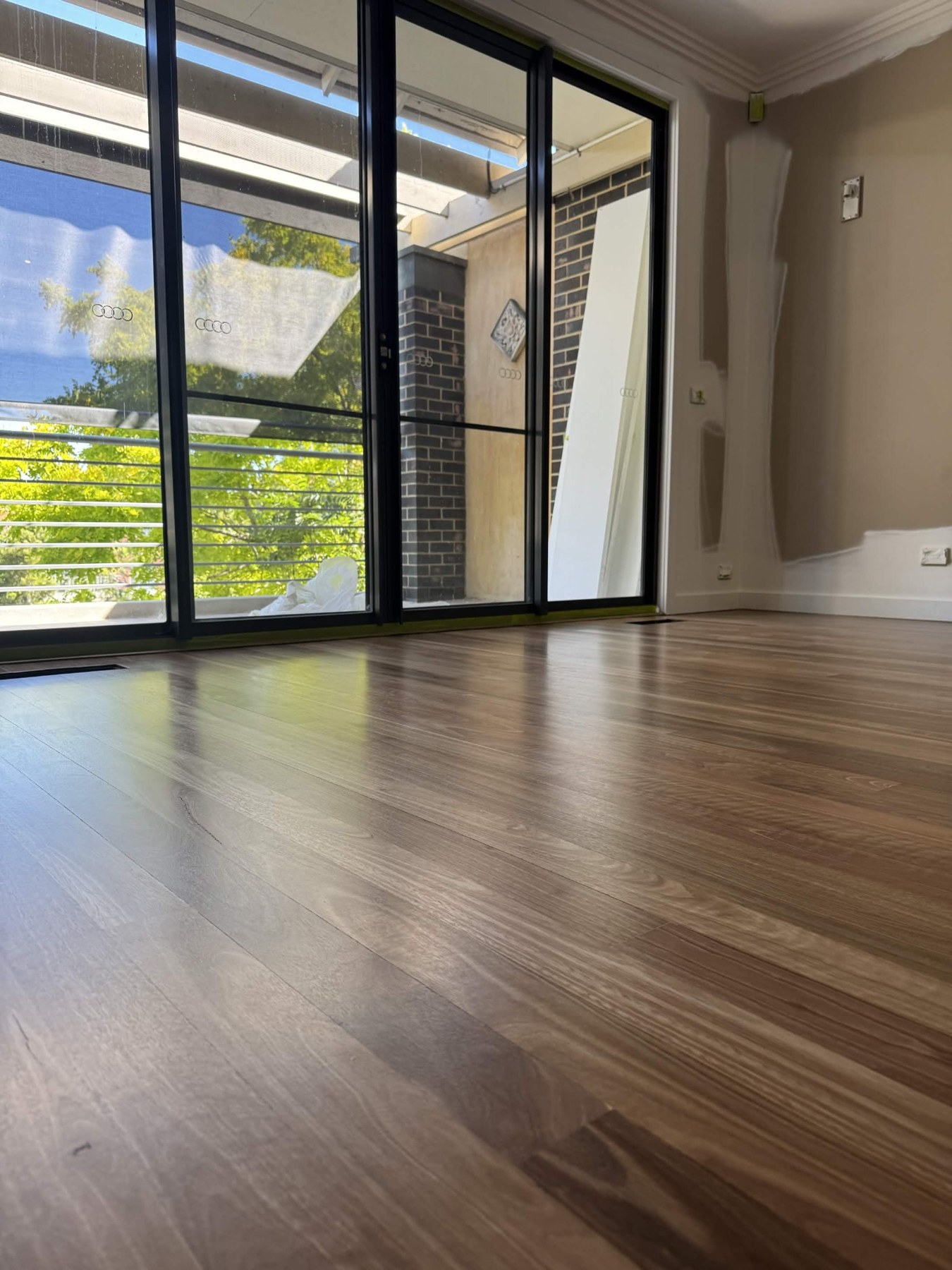 Low angle timber floor photo near sliding doors