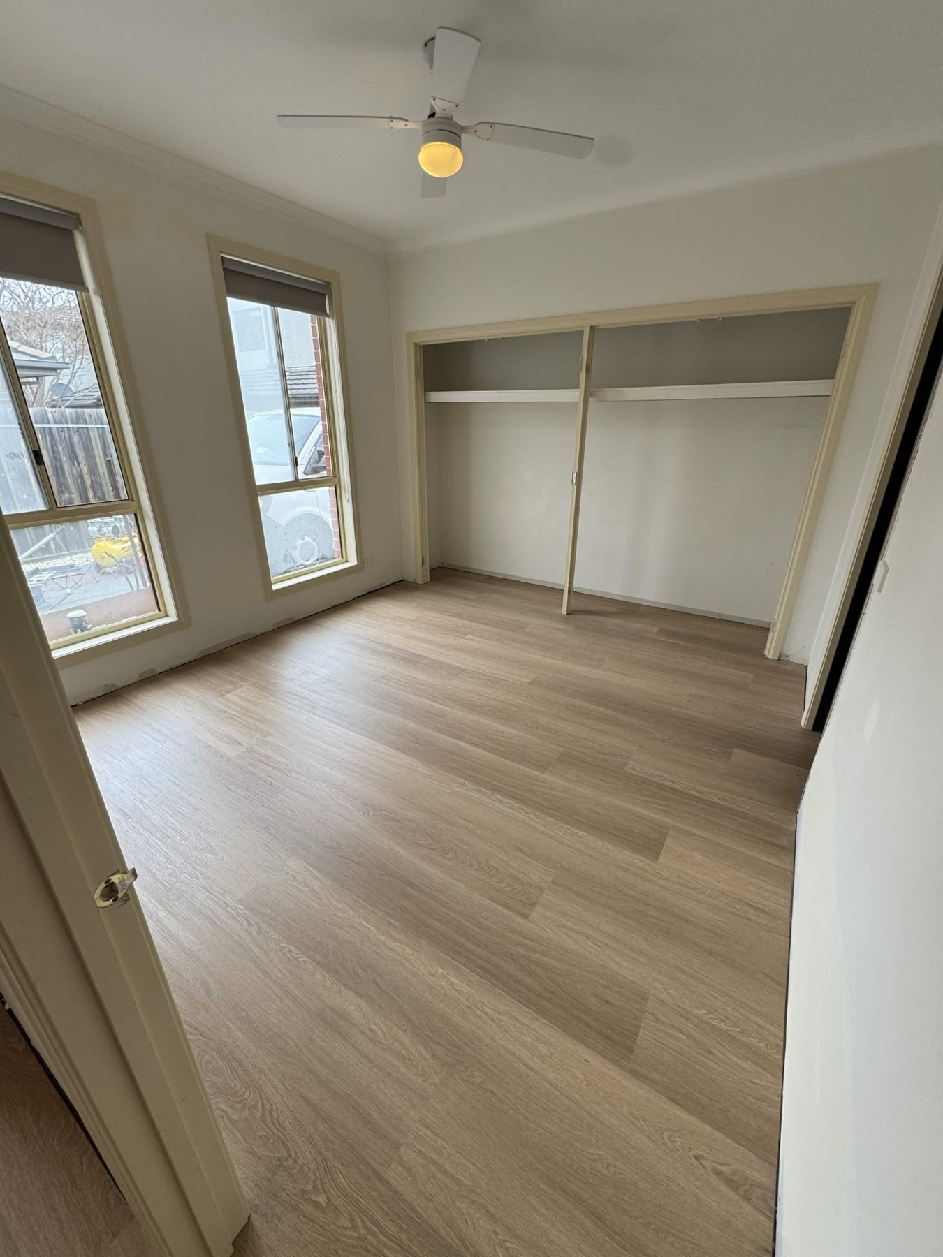 Light hybrid flooring in a bedroom